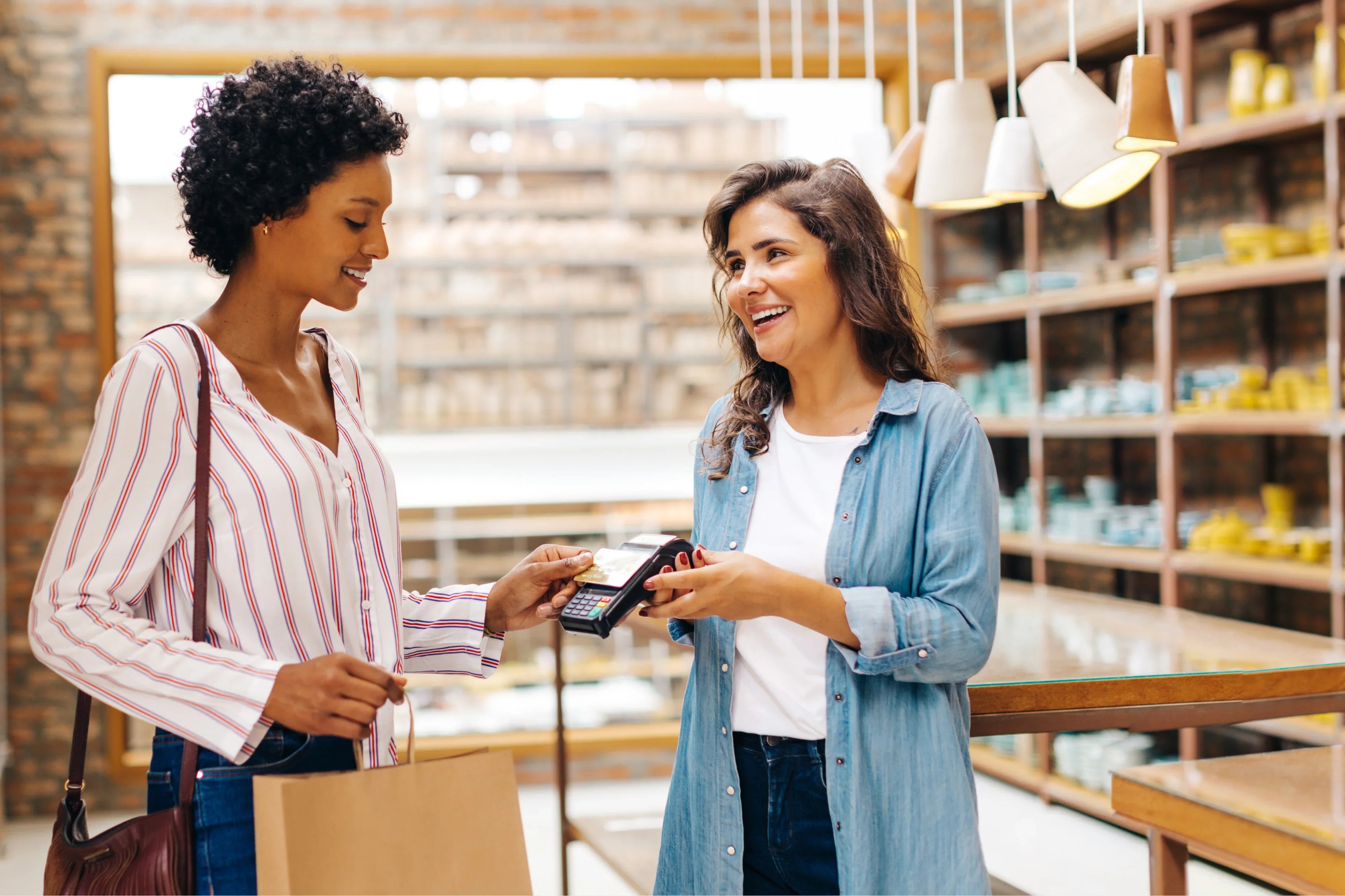 A woman completing a purchase at a small business.
