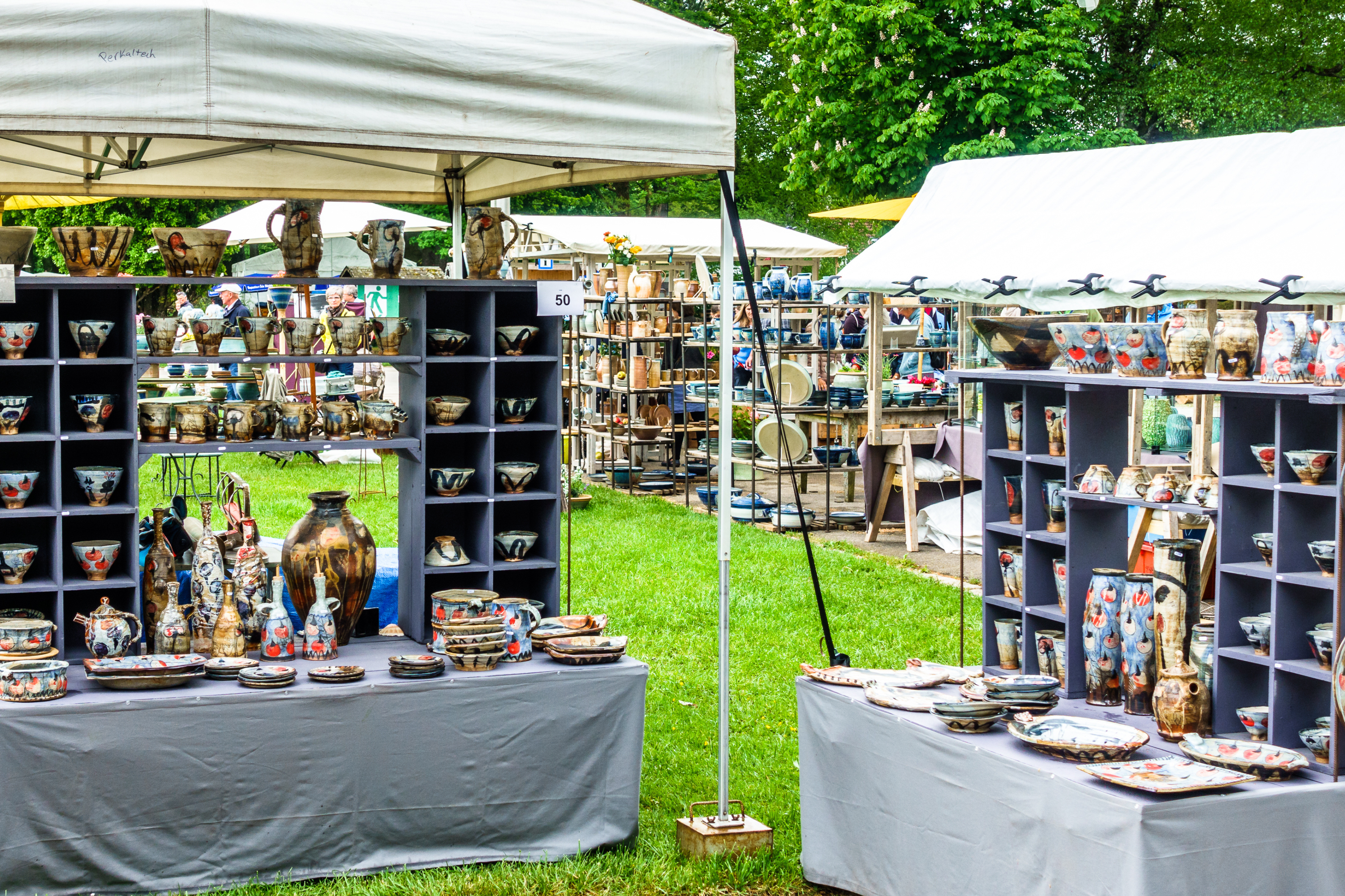 Mutiple Craft Booths Display at an Outdoor Craft Fair.