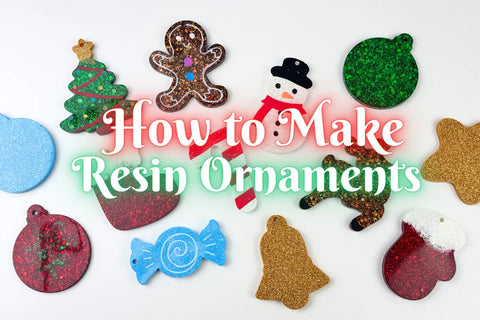 Finished resin Christmas ornaments in red, gold, and white with glitter accents hanging on a tree.