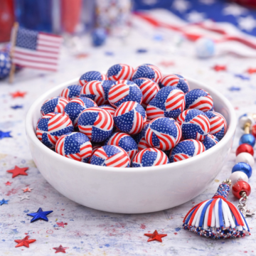 Patriotic American flag beads in bowl, ideal for wholesale bead crafting supplies, fast US shipping.