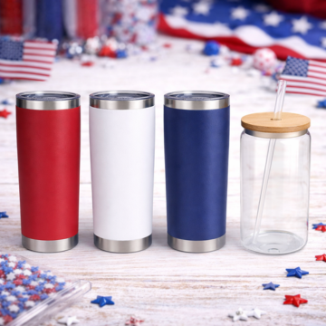 Red, white, and blue tumblers and clear glass jar for crafts on patriotic themed table