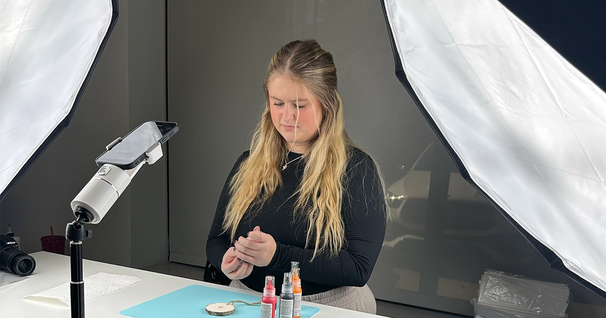 Katie May - Founder of DIY Craft Warehouse filming social media post. DIY Craft Warehouse